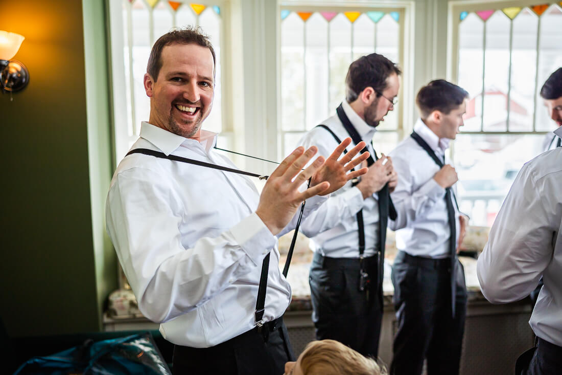 Groomsmen getting ready for a hotel saranac wedding