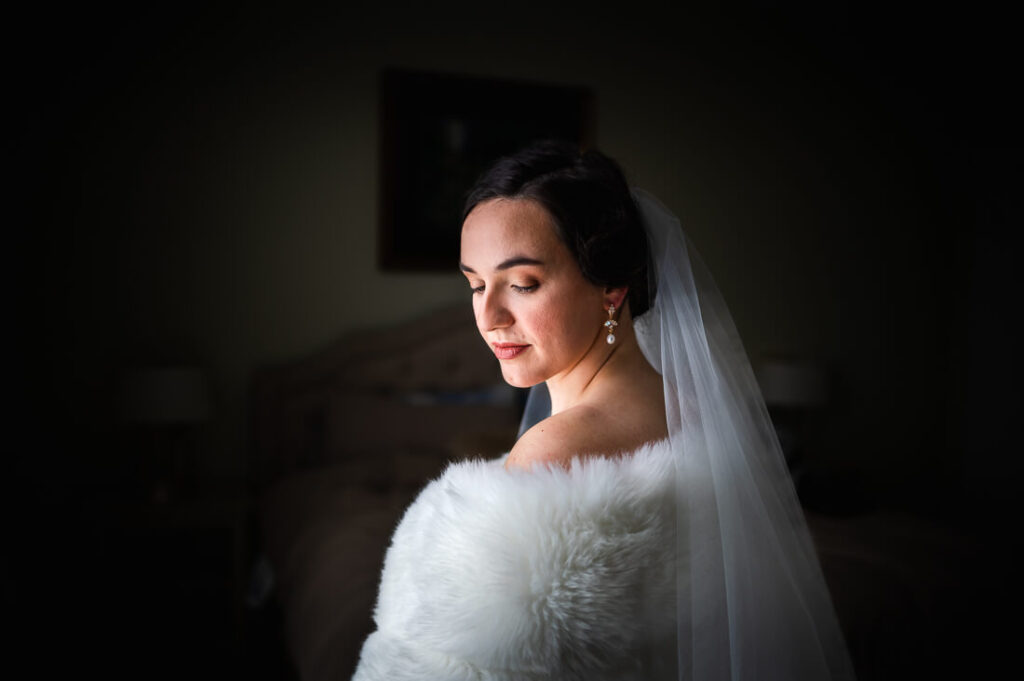 Bride looking over her shoulder after getting ready for her Hotel Saranac Wedding