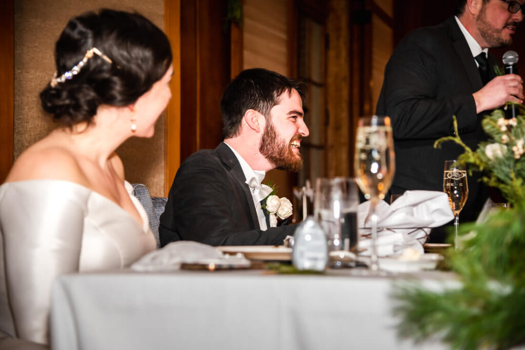 Groom laughing during a Hotel Saranac Wedding speech