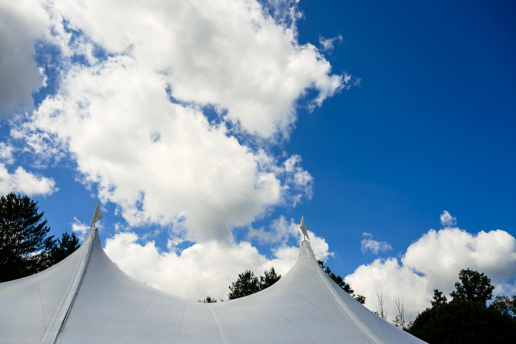 Wedding tent with blue sky and clouds